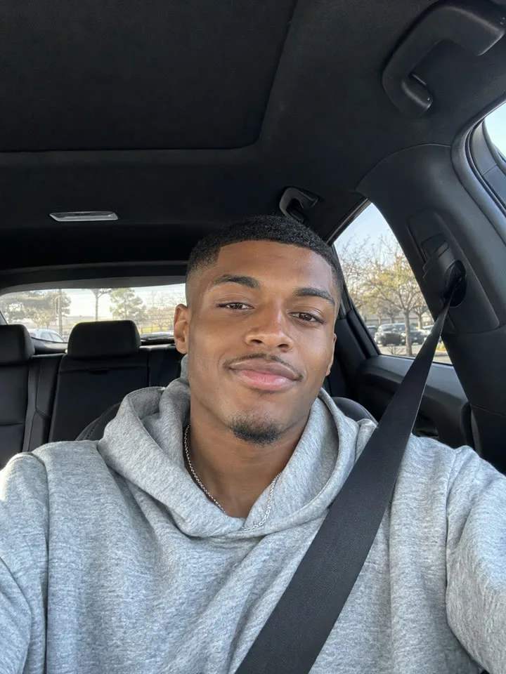 The selfie he uploaded: a quick shot from the driver’s seat in a grey hoodie